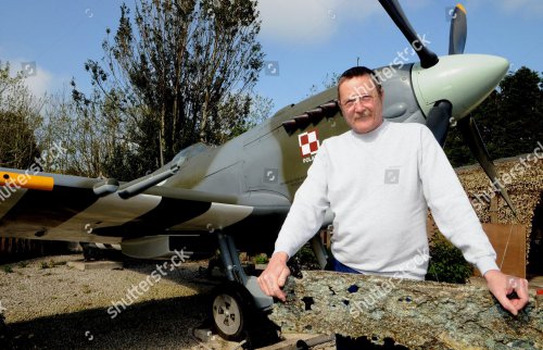 barry-wallond-with-his-replica-ww2-spitfire-near-raf-st-mawgan-cornwall-britain-may-2011-shutterstock-editorial-1334351d.jpg